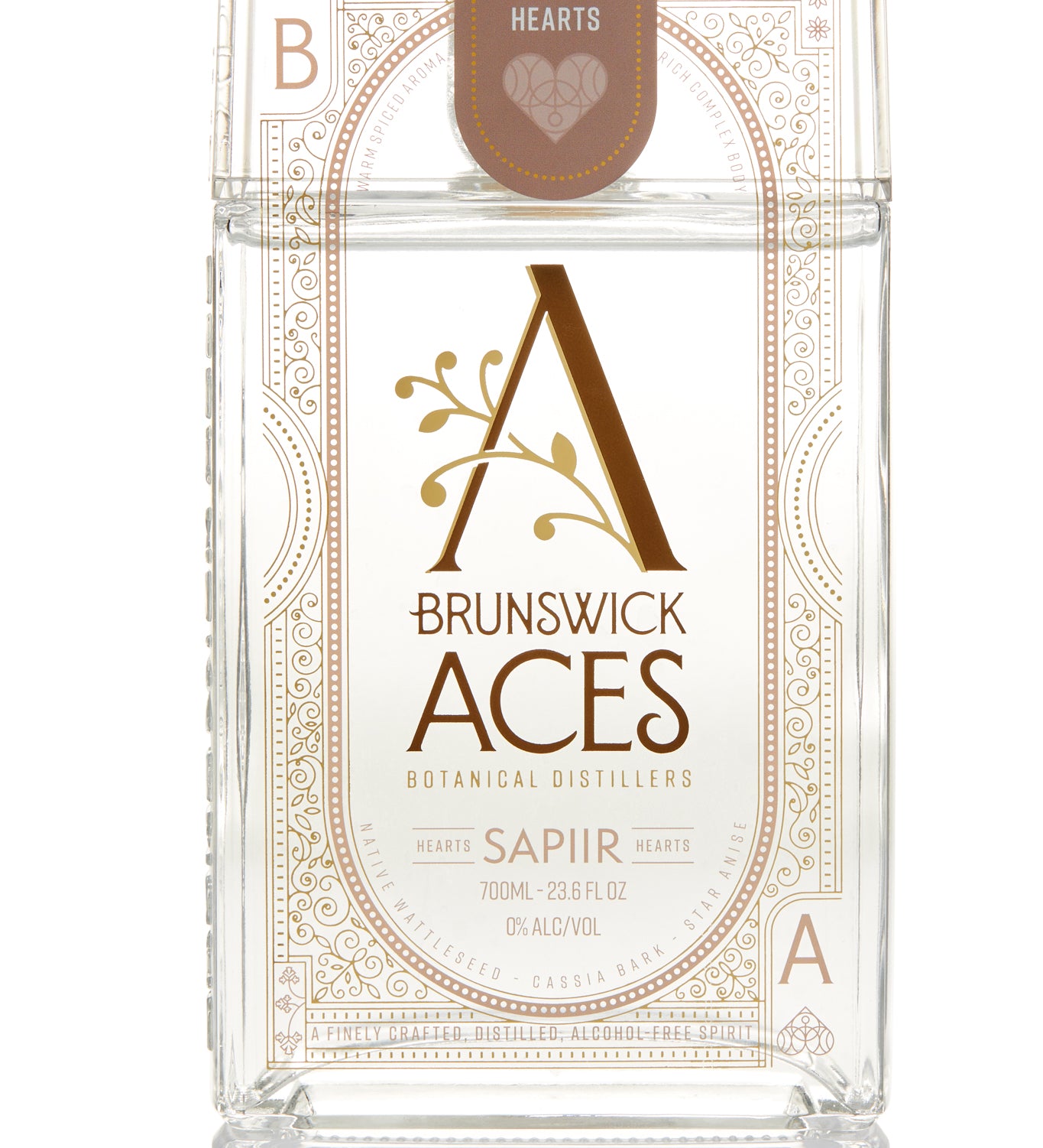 A bottle of Brunswick Aces Sapiir, an alcohol-free distilled botanical spirit. The label features an ornate "A" logo and highlights the use of native Australian desert lime and mango. The bottle is 700ml and 0% alcohol.