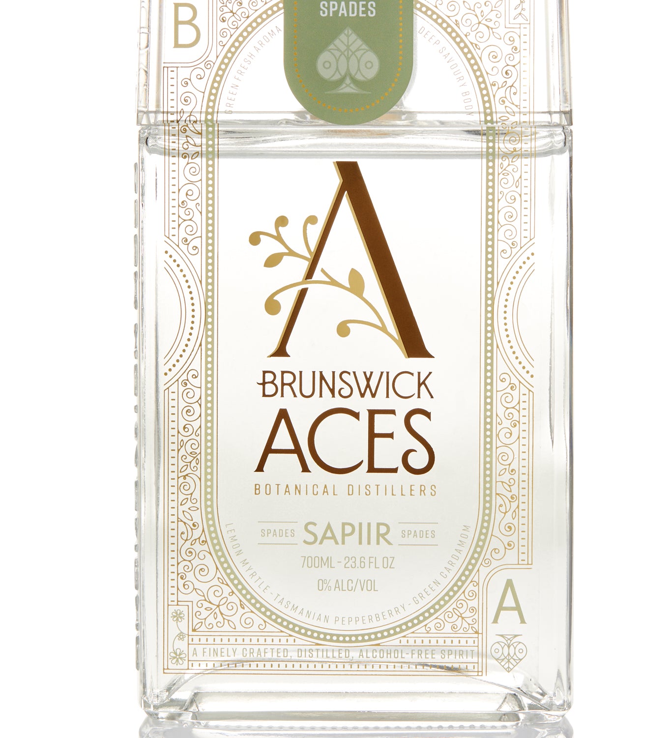 A bottle of Brunswick Aces Sapiir, an alcohol-free distilled botanical spirit. The label features an ornate "A" logo and highlights the use of native Australian desert lime and mango. The bottle is 700ml and 0% alcohol.