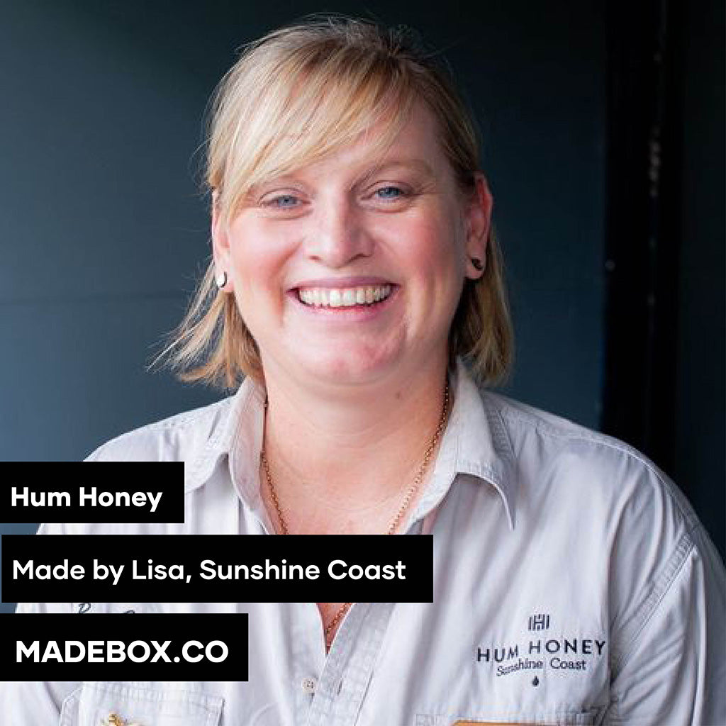 A portrait of Lisa from Hum Honey, based in the Sunshine Coast. She smiles warmly, wearing a branded Hum Honey shirt. Text overlay highlights MADEBOX.CO branding.