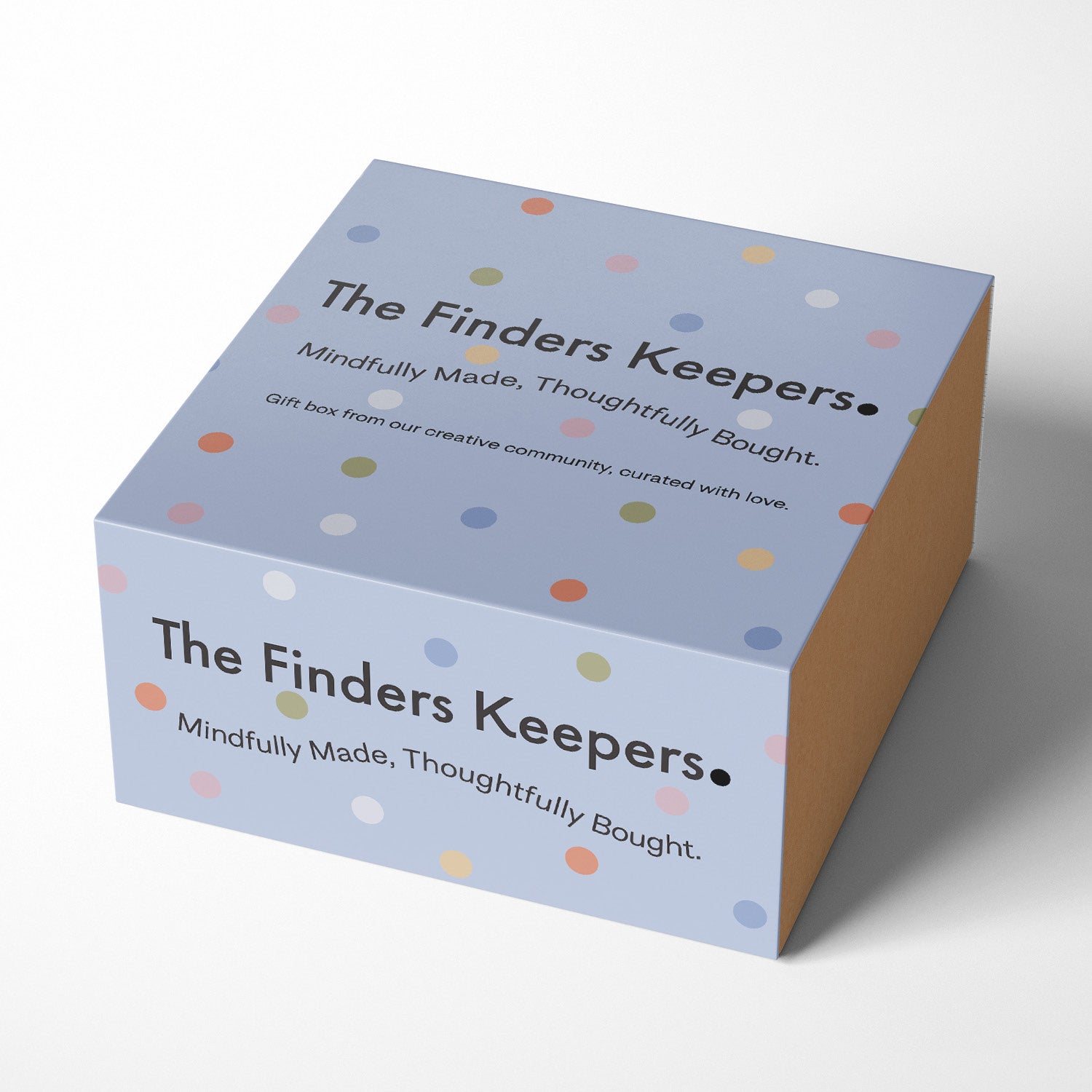 A Purple spotted box with the text: The Finders Keepers, Mindfully Made, Thoughtfully Bought Gift box from our creative community, curated with love.